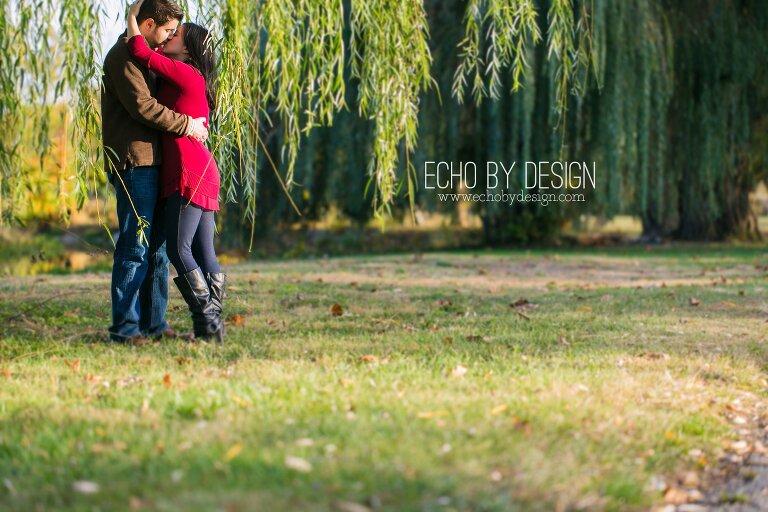 Engagement photo of couple in willow trees