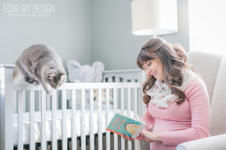 Pregnant Mom reads book in the Nursery
