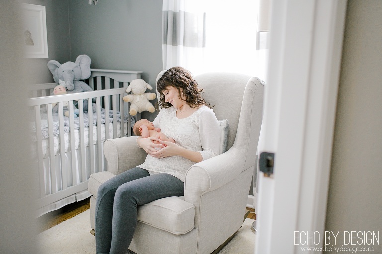 Lifestyle Newborn Photo of Mom in Rocking Chair with Baby