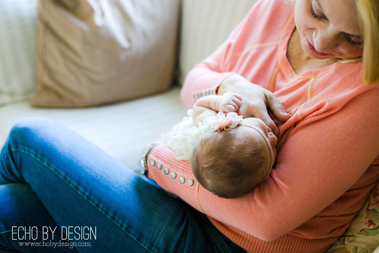 Mom holds and soothes newborn baby