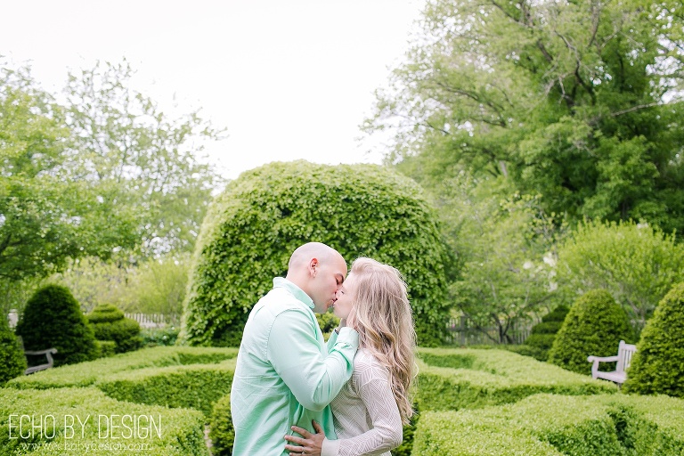Couple kissing at Wegerzyn Gardens Engagement Session