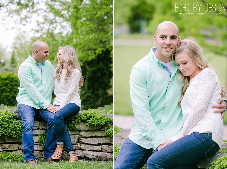 Couple sits on stone wall at Wegerzyn Gardens